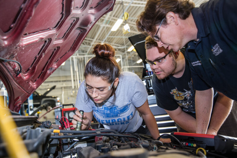 ACC students working on a car
